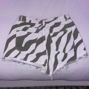 green and white patterned jean shorts